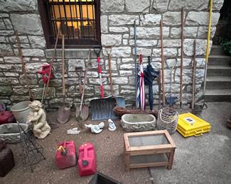Lots of shovels, hand tools and garden equipment