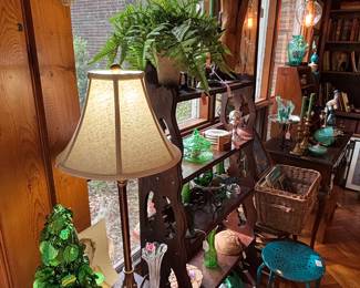 Several pretty Stained glass pieces hanging in the windows