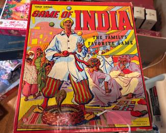 Games! This is a fabulous and unique cover. This game was the inspiration for Parcheesi.