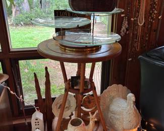 Super MCM glass serving plates sitting atop a unique side table. Everyone needs a huge white turkey;) We will have jewelry throughout the front room