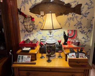 Of course I love the old metal fish, but my favorite is the vintage catchers mask! We have some great furniture too, and this is a sweet, small gentleman‘s dresser
