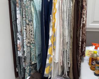 Remember me saying the lady of the house was a realtor? These are all shower curtains that she used for staging houses. We also have multiple seats of hooks.