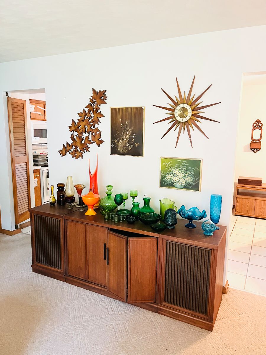 Lots of beautiful MCM colored glass!
Sunburst clock and other fun decor!
Console stereo cabinet
Can be purchased with or without record player, CD player, etc.
