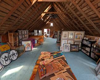 Art studio with hundreds of art pieces that included handmade benches, each with their own painted design that includes a story behind the design origin, drawings, paintings, wall hangers, and so much more.