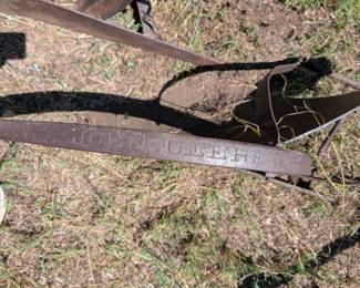The "John Deere 191 plow" refers to a specific model of walking plow produced by John Deere, likely a horse-drawn model. The "191" designation typically refers to the beam or frame of the plow. These plows were common during the era of horse-drawn agriculture and are now often sought after for restoration or as historical artifacts