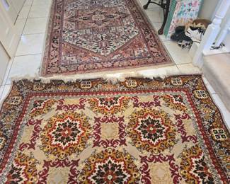 A couple of all will rugs of different sizes. Area rugs.