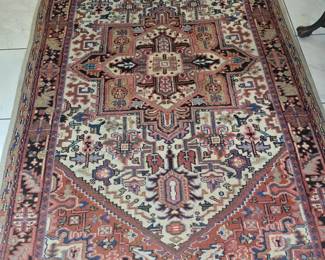 Hand knotted rug that needs a little repair.
