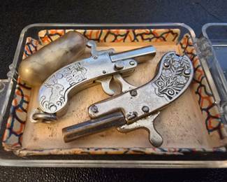 Antique key fob cap guns