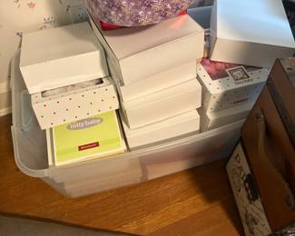 Boxes of doll clothes for American Girl 