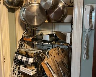 Stainless steel pots and pans, wall phone.