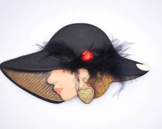 lady in black hat brooch