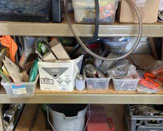 Three Shelves Of Miscellaneous Tools And Home Improvement Items