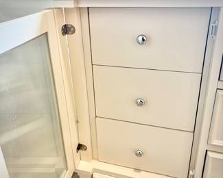Tall white dresser with 11 drawers - 6 drawers concealed behind cupboard doors.