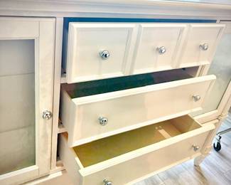 Tall white dresser with 11 drawers - 6 drawers concealed behind cupboard doors.
