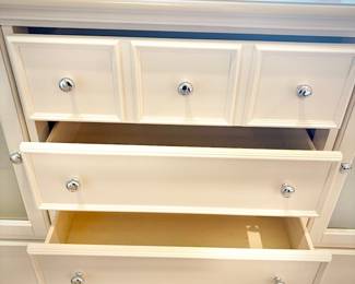 Tall white dresser with 11 drawers - 6 drawers concealed behind cupboard doors.