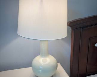 One of two contemporary white lamps