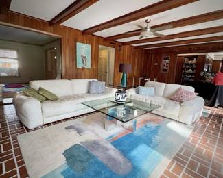 Scan Design Fat Boy white leather sofa and loveseat with West Elm area rug