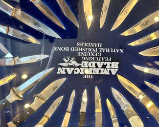 American blade store display full of pocket knives