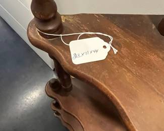H136 - $30. Vintage Wooden Display Shelf. Measures 23" wide x 11" deep x 44" tall.