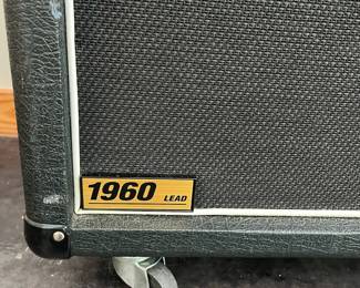 H113 - $500. Marshall 1960A 300 watt Angled Stereo Cabinet. Has small hole and some discoloration. Measures 30" wide x 14" deep x 32" tall.