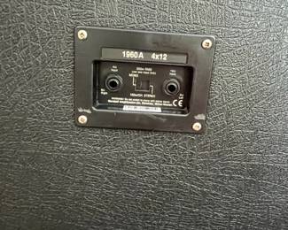 H113 - $500. Marshall 1960A 300 watt Angled Stereo Cabinet. Has small hole and some discoloration. Measures 30" wide x 14" deep x 32" tall.