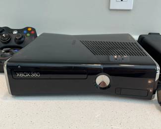 H66 - $80. xbox360s. Includes 2 controllers & 14 games.