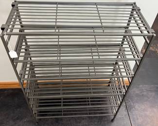H103 - $30. Adjustable shelving unit / shoe storage. Measures 26.5" x 12.5" x 37" tall.