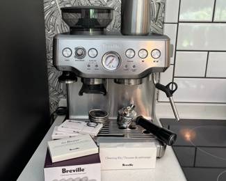 H57 - $350. Breville Barista Express Espresso Machine with accessories and cleaning kit.
