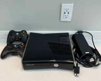H66 - $80. xbox360s. Includes 2 controllers & 14 games.