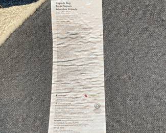 H80 - $350. West Elm Capsule Rug. Measures 8' x 10'. 68% Wool 32% Viscose.