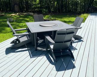 H38 - $950. Priced together as Photographed. Solo Stove Bonfire Fire pit with Lid. Removable Base plate & Ash Pan. Stand and cover. Surround Extend & Surround Surface. 4 - 1903 Terraflame Adirondack Chairs.