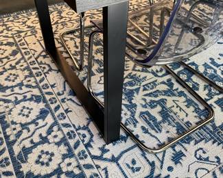 H84 - $475 SET. Ikea Tranebo Dining Table. Measures 36.5" wide x 87" long x 30" tall. Overall very good condition - does have some surface marks. 6 Ikea Tobias Clear & Chrome Plated Chairs. 5 are in very good condition. 1 has a crack - still useable.