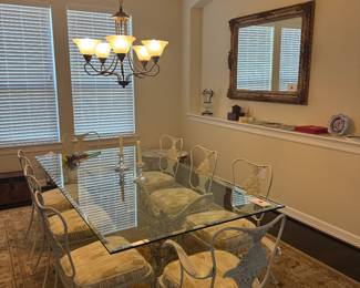 Beveled glass wrought iron dining table with eight chairs. Seating. for eight Woodard vintage never used.