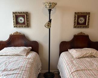 Louis the 16th gilt wood French twin bed set. Antique porcelain plate on velvet in Gilded hand-carved frame. Antique Tiffany stained glass floor lamp.