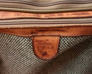 S129 - $40 - Hartmann Tweed Leather Rolling Carry On Luggage Garment Bag Suitcase. Great condition. Some spotting on name tag. See all photos. All mechanics (zippers, wheels, handles) work as they should. 22"w x 19"d x 9"t