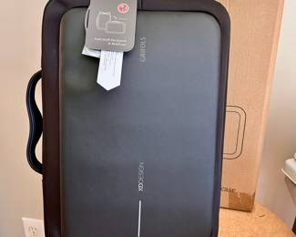 S133 - $30 - New in box w/ tags. XD Design Antitheft Backpack & Briefcase.