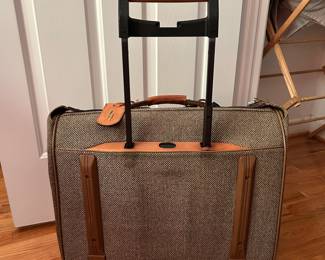 S129 - $40 - Hartmann Tweed Leather Rolling Carry On Luggage Garment Bag Suitcase. Great condition. Some spotting on name tag. See all photos. All mechanics (zippers, wheels, handles) work as they should. 22"w x 19"d x 9"t