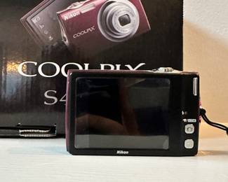S127 - $60 - Nikon Coolpix. Used like NEW. Still has the protective plastic on it! Tested, working.