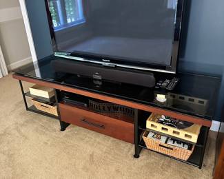 S57 - $40 - Entertainment Center in great condition. No damage or issues. Measures 70"w x 23.5" x 20"T