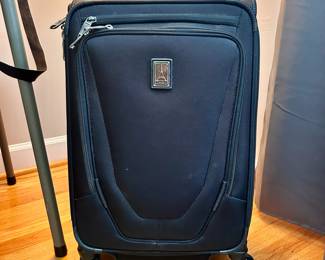 S132 - $35 - Travelpro Carry On Spinner Suitcase. Black. All mechanics work as they should. Interior and exterior in good condition.