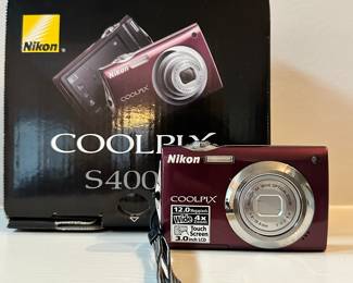 S127 - $60 - Nikon Coolpix. Used like NEW. Still has the protective plastic on it! Tested, working.