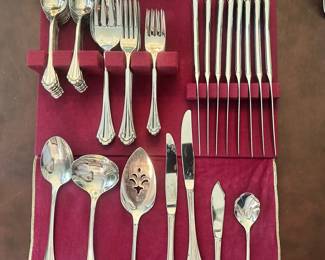S183 - $70 - Community Silver Plated Flatware Set. 10 salad forks, 10 dinner forks, 10 dinner knives, 10 soup spoons, 10 soufflé spoons, and serving ware.