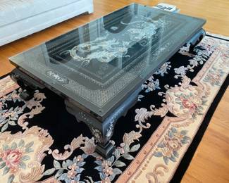 LOT 2: Large Rectangular Asian Mother-of-Pearl Black Lacquer Coffee Table. Comes with removable custom-made glass top to protect design and for functional use. Table Measurements: Width: 61.5". Depth: 35". Height: 14.5".  Condition: Very good commensurate with vintage age. 