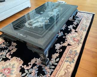 LOT 2: Large Rectangular Asian Mother-of-Pearl Black Lacquer Coffee Table. Comes with removable custom-made glass top to protect design and for functional use. Table Measurements: Width: 61.5". Depth: 35". Height: 14.5".  Condition: Very good commensurate with vintage age. 