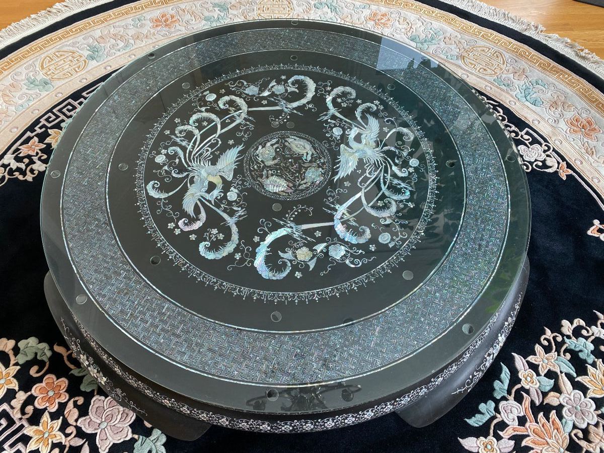 LOT 1: Large Round Asian Mother-of-Pearl Black Lacquer Coffee Table. Comes with removable custom-made glass top to protect design and for functional use.  Table Diameter: 45". Height: 15.5".                       Condition: Very good commensurate with vintage age.