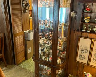 One of two matching curio caninets