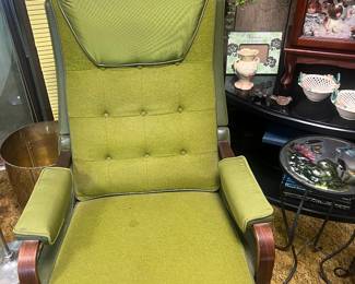 One of two vintage recliners. One yellow one green