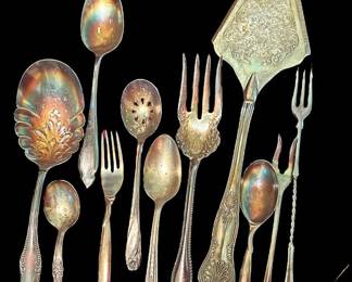 Silver Plated Utensils In A Oneida Purple