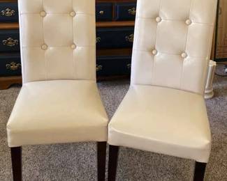 Two Cream Color, Leather Bonded Chairs