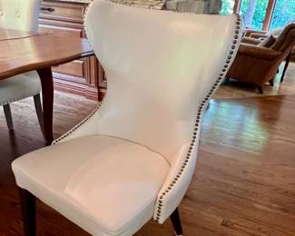 2 Matching faux leather chairs w/nail head back - - sold separate from the table